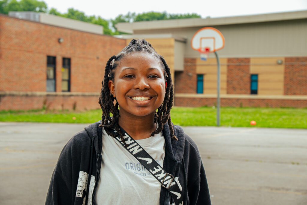 A young girl smiles outside while at the Boys & Girls Clubs of Greater St. Louis. 