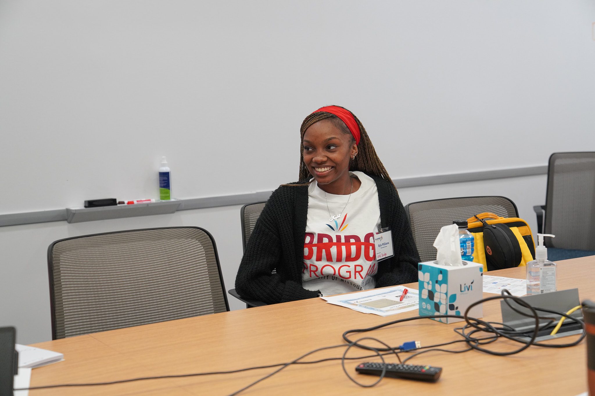 A woman listens in on a round table discussion during the breakout sessions at camp summit.