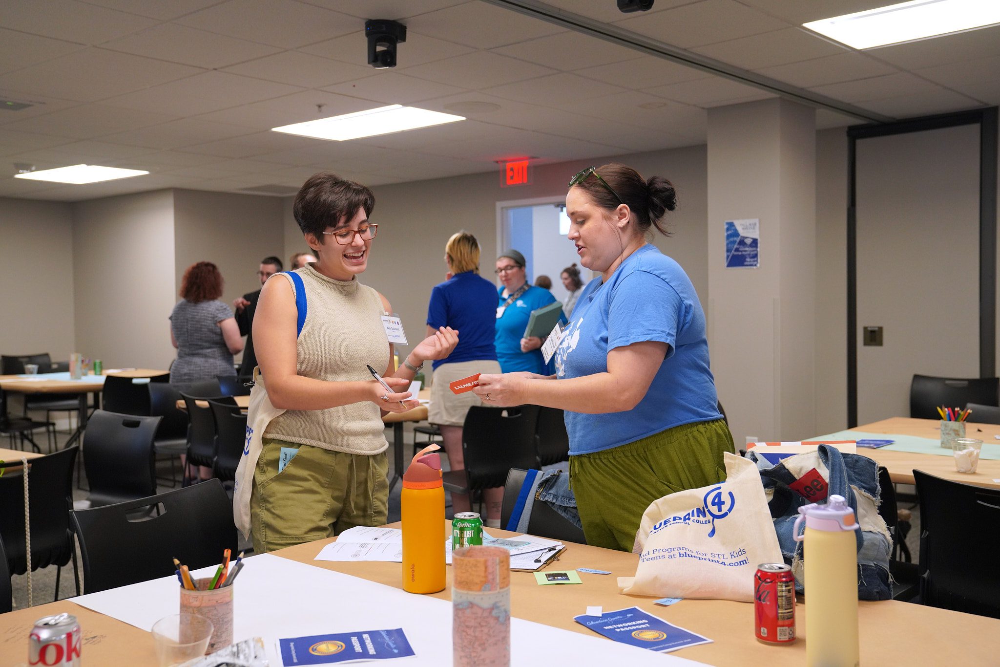 Camp providers network with one another and share business cards.