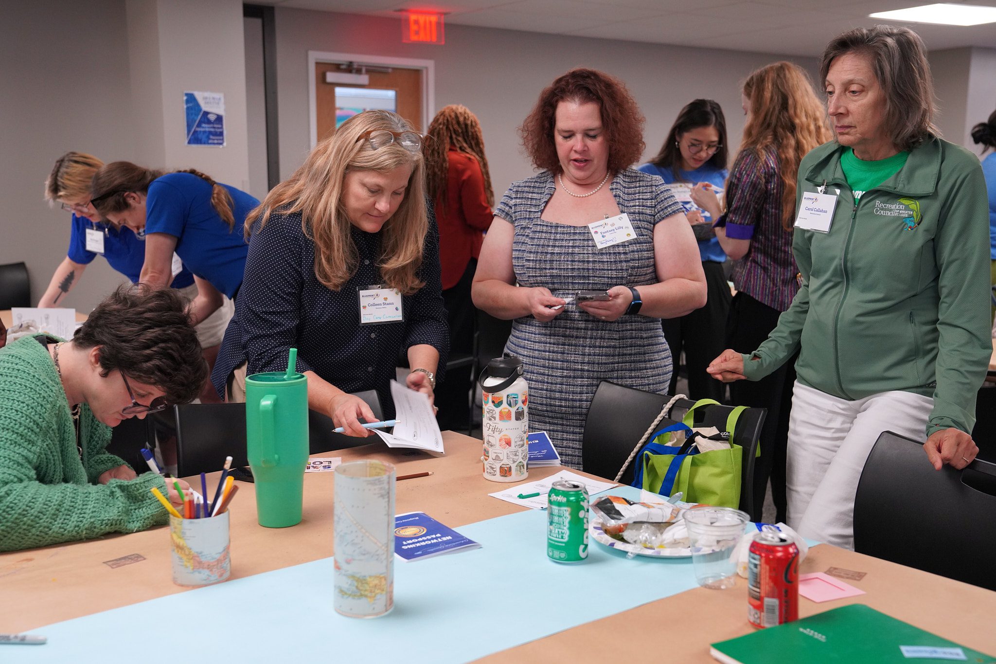 Camp providers network with one another and fill out their camp summit passports.