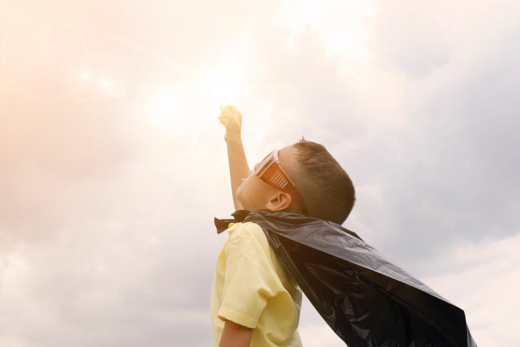 Kid in superhero costume